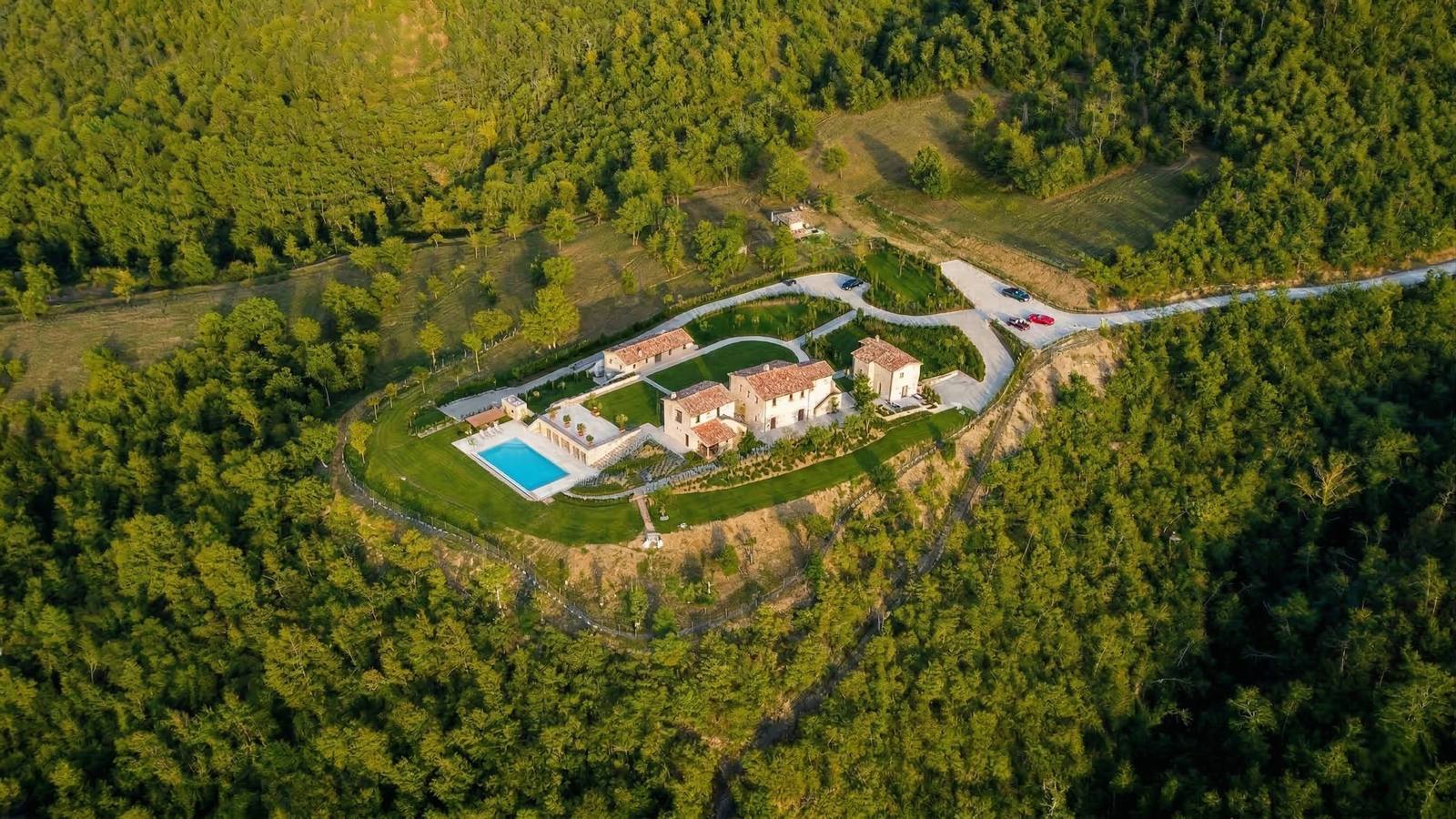 Estate Passignano — Lake Trasimeno hilltop estate rebuilt from ruin, aerial view